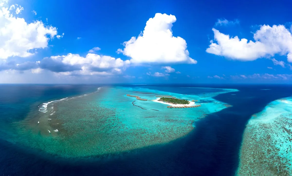 Aerial view of Fuvahmulah island surrounded by coral reefs
