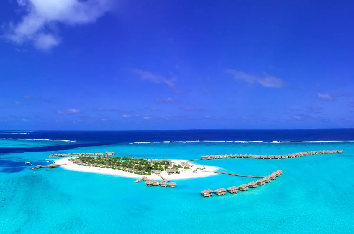 Aerial view of a tropical island resort in South Malé Atoll