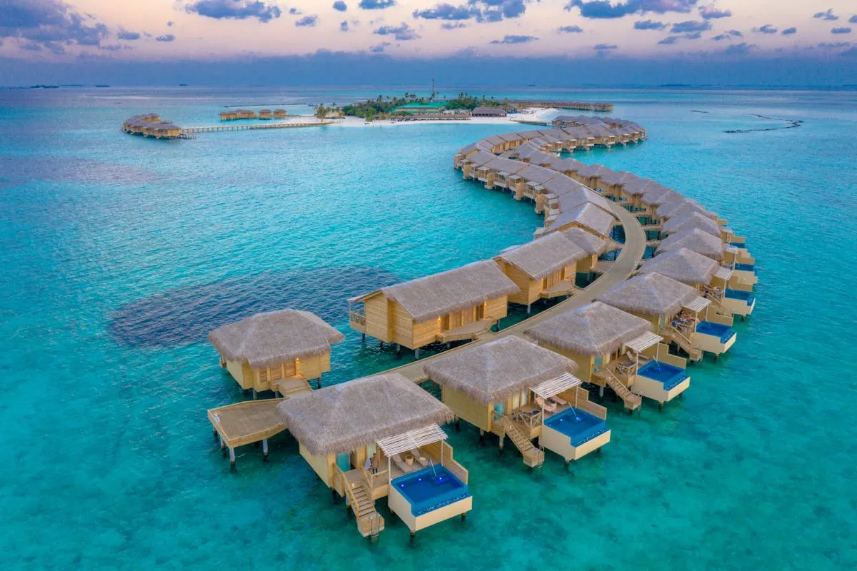 Luxury overwater villas at sunset in the Maldives